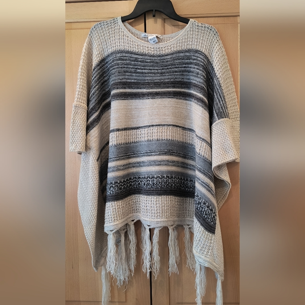 American Rag tan and blue poncho sweater. Soft and lightweight. Size M/L